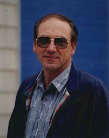 image of a smiling man in sunglasses